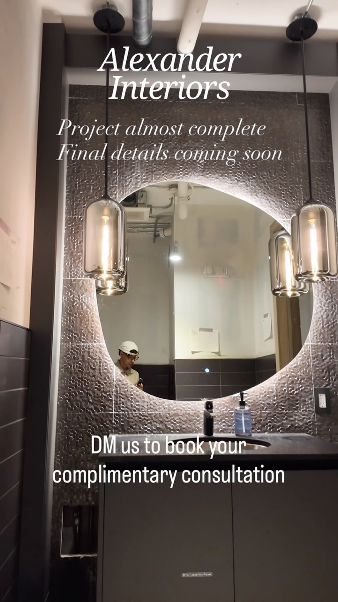Commercial renovation reel showing an illuminated mirror and a curved tiled arch
